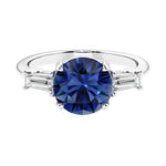 Lab diamond engagement ring in 14k white gold with round blue sapphire center and two matching diamonds for timeless beauty.