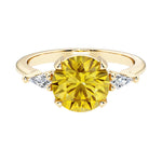 Handcrafted round center fancy yellow diamond alternative yellow sapphire engagement ring with sparkling diamond sides.