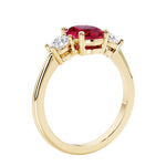 Oval 3 stone engagement ring with brilliant diamond side stones.