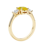 Oval 3 stone engagement ring with brilliant diamond side stones.