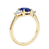 Oval 3 stone engagement ring with brilliant diamond side stones.