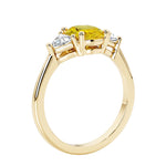 Oval 3 stone engagement ring with brilliant diamond side stones.