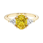 Oval cut three stone diamond engagement ring with romantic charm with yellow gemstone center 14k yellow gold