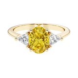 Oval cut three stone diamond engagement ring with romantic charm with yellow gemstone center 14k yellow gold