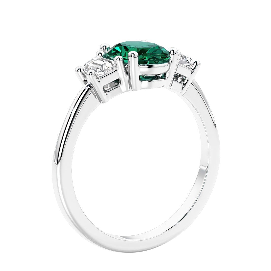 Engagement ring with oval shaped green gemstone and diamonds in a 3 stone design.