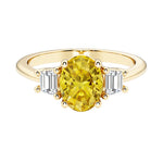 3 stone oval engagement ring with elegant proportions with yellow gemstone and diamonds.