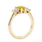 Yellow Diamond alternative yellow sapphire three stone pear shaped engagement ring with classic styling.