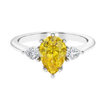 Yellow Sapphire 3 stone pear diamond ring set in a delicate band.