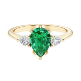 Green Emerald pear shaped 3 stone engagement ring with elegant diamond side stones.