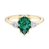 Green Emerald pear shaped 3 stone engagement ring with elegant diamond side stones.