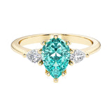 Paraiba Tourmaline pear shaped 3 stone engagement ring with elegant diamond side stones.