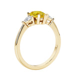 Yellow Sapphire three stone pear shaped engagement ring with classic styling.