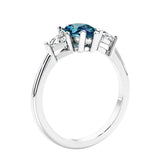 3 stone diamond engagement ring with pear shaped center in white gold featuring Alexandrite.