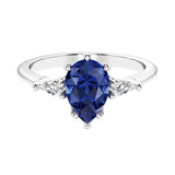 Blue Gemstone 3 stone pear diamond ring set in a delicate band.