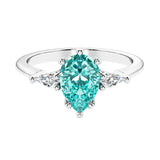 Green Gemstone 3 stone pear diamond ring set in a delicate band.