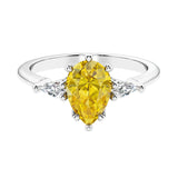 Yellow Gemstone 3 stone pear diamond ring set in a delicate band.