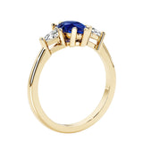 Blue Gemstone three stone pear shaped engagement ring with classic styling.