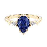 Blue Gemstone pear shaped 3 stone engagement ring with elegant diamond side stones.