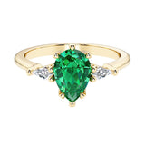 Green Gemstone pear shaped 3 stone engagement ring with elegant diamond side stones.