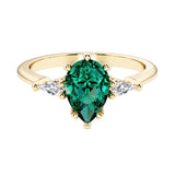 Green Gemstone pear shaped 3 stone engagement ring with elegant diamond side stones.