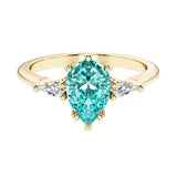 Green Gemstone pear shaped 3 stone engagement ring with elegant diamond side stones.