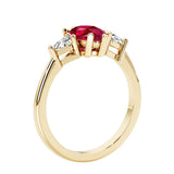 Red Gemstone three stone pear shaped engagement ring with classic styling.