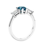 3 stone diamond engagement ring with pear shaped center in white gold featuring Alexandrite.