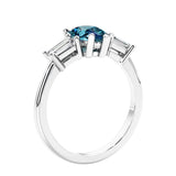 3 stone diamond engagement ring with pear shaped center in white gold featuring Alexandrite.