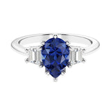 Blue Gemstone 3 stone pear diamond ring set in a delicate band.