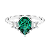 Green Emerald 3 stone pear diamond ring set in a delicate band.