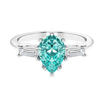 Paraiba Tourmaline 3 stone pear diamond ring set in a delicate band.