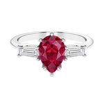 Ruby 3 stone pear diamond ring set in a delicate band.