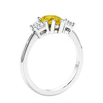 3 stone diamond engagement ring with pear shaped center in white gold featuring Yellow diamond.