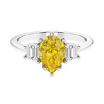 Yellow diamond 3 stone pear diamond ring set in a delicate band.