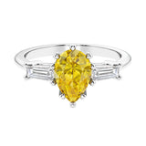 Yellow diamond 3 stone pear diamond ring set in a delicate band.