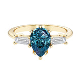 Alexandrite pear shaped 3 stone engagement ring with elegant diamond side stones.