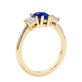 Blue Gemstone three stone pear shaped engagement ring with classic styling.