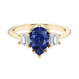 Blue Gemstone pear shaped 3 stone engagement ring with elegant diamond side stones.