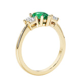 Colombian Green Emerald three stone pear shaped engagement ring with classic styling.