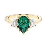 Green Emerald pear shaped 3 stone engagement ring with elegant diamond side stones.
