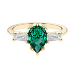 Green Emerald pear shaped 3 stone engagement ring with elegant diamond side stones.