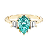 Paraiba Tourmaline pear shaped 3 stone engagement ring with elegant diamond side stones.