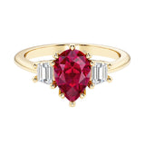 Ruby pear shaped 3 stone engagement ring with elegant diamond side stones.