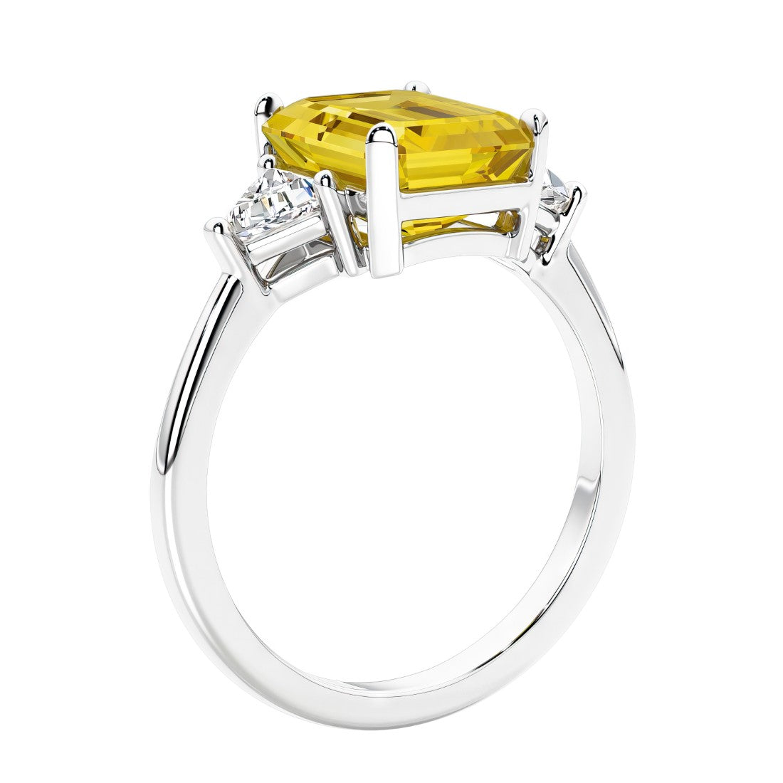 3 stone emerald cut diamond ring in modern gold setting with yellow gemstone center.