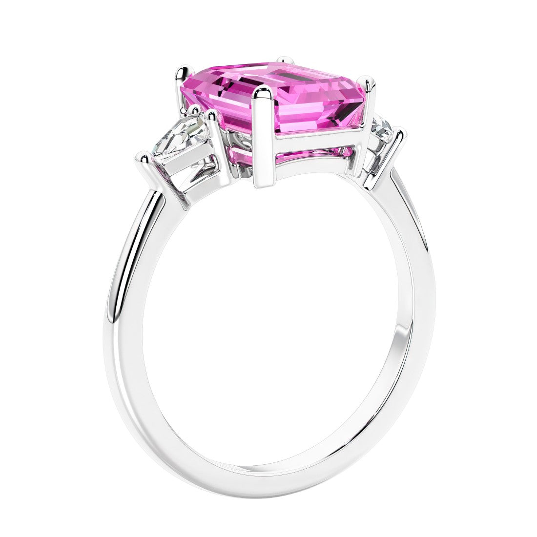 3 stone emerald cut diamond ring in modern gold setting with pink gemstone center.