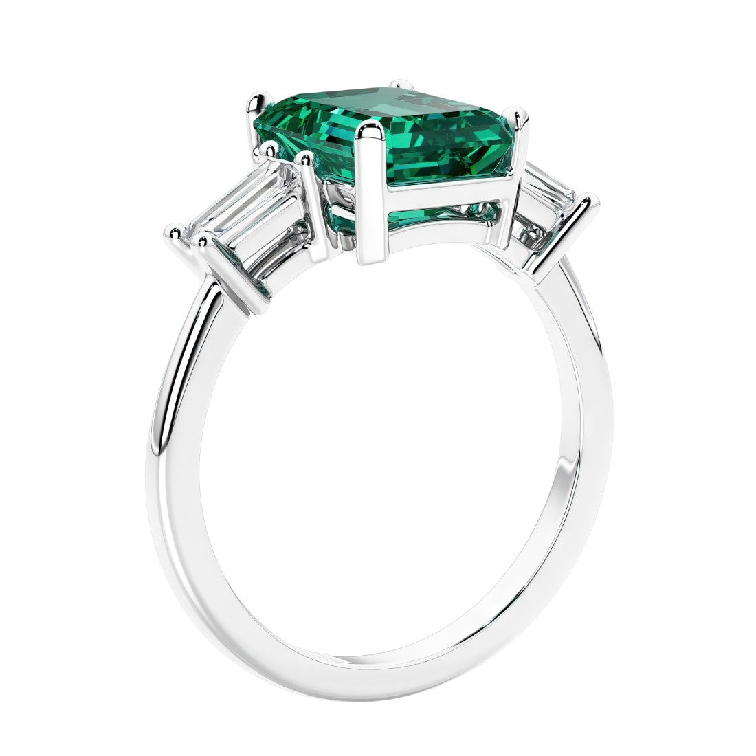 3 stone emerald cut diamond ring in modern gold setting with green gemstone center.