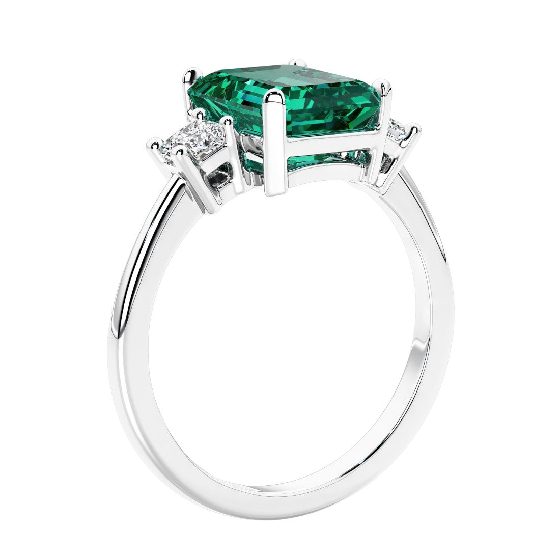 3 stone emerald cut diamond ring in modern gold setting with green gemstone center.