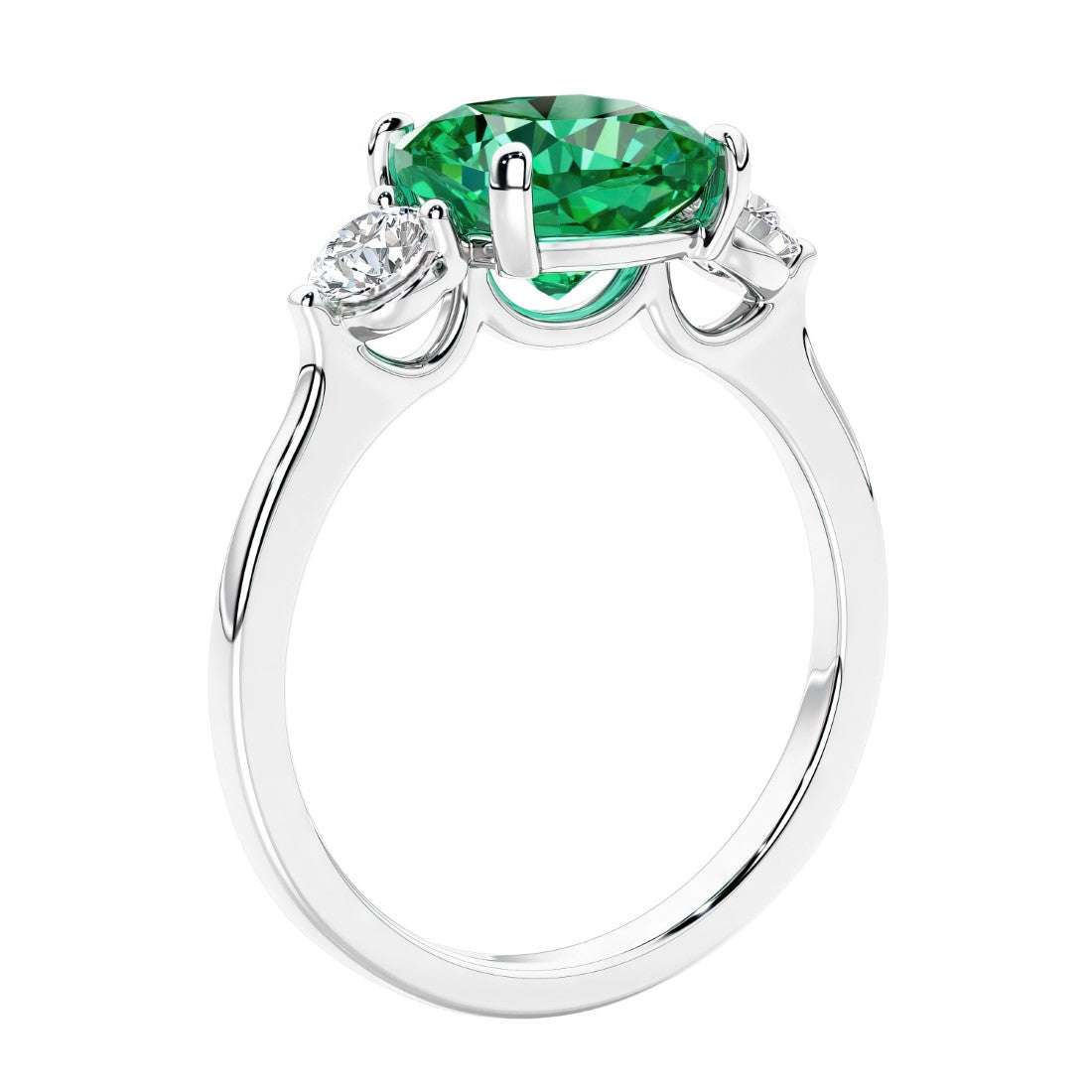 Cushion cut diamond ring with colombian emerald as a unique engagement ring featuring three stone design.