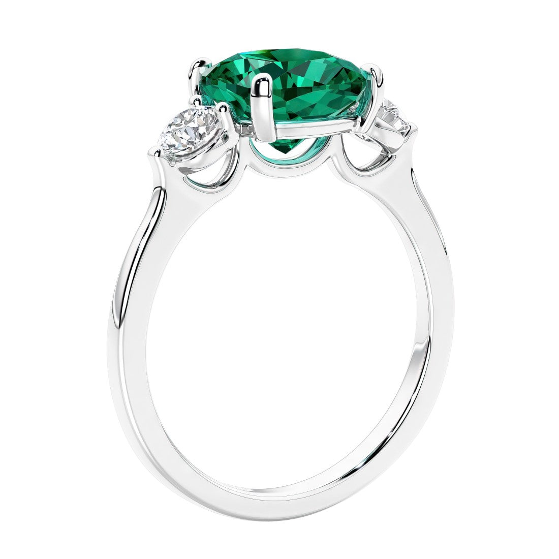Cushion cut diamond ring with emerald as a unique engagement ring featuring three stone design.