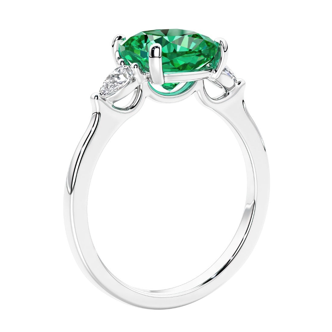 Cushion cut diamond ring as a unique engagement ring featuring three stone design with colombian emerald and diamonds.